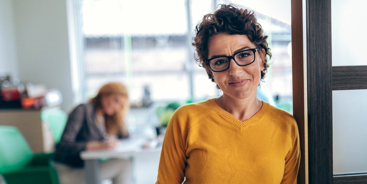 professional woman in the office, smiling
