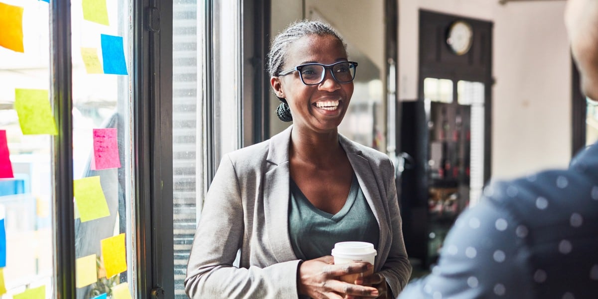 professional woman smiling, in the office