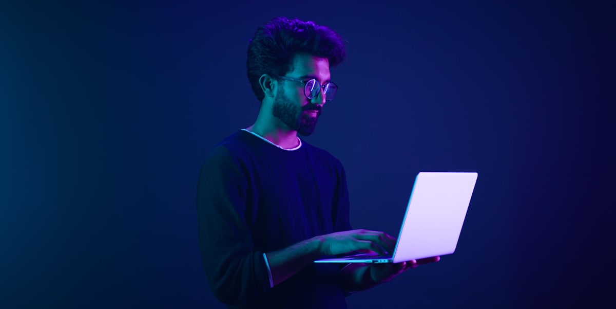 man holding laptop