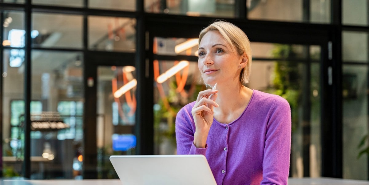 professional woman at office, using laptop