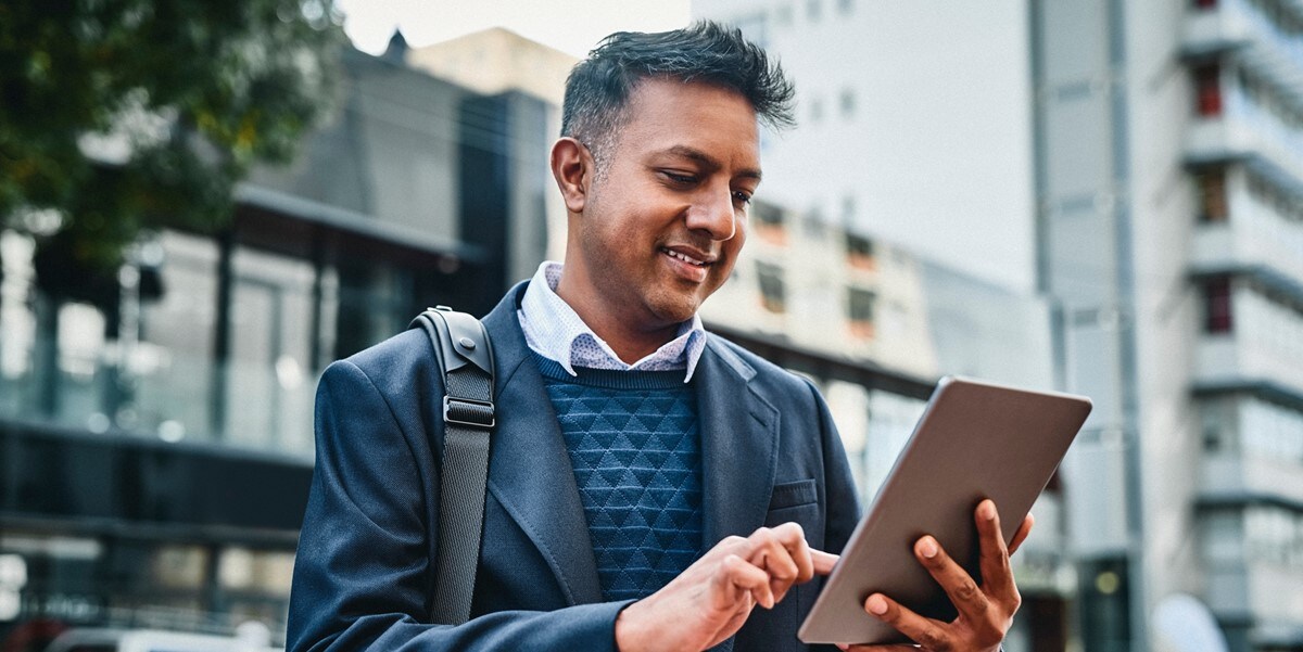traveler in city, looking at tablet