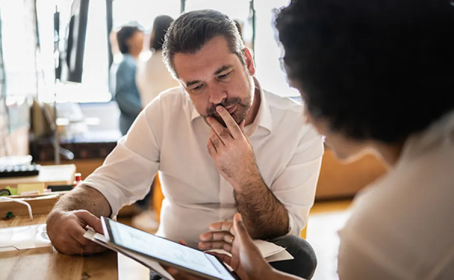 Man looking at screen with woman