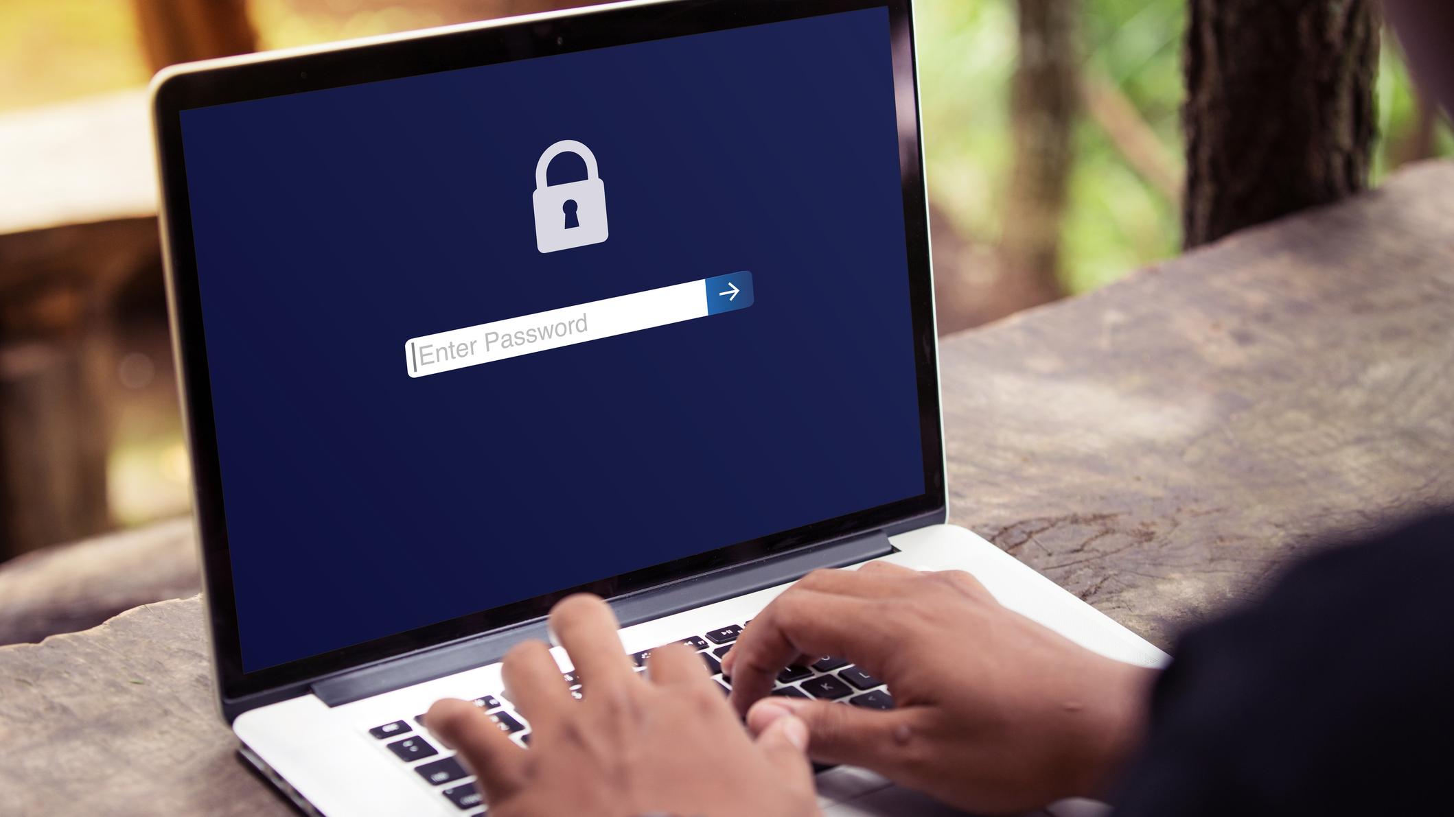 man navigating security screen on laptop