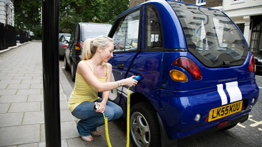 woman with electric car