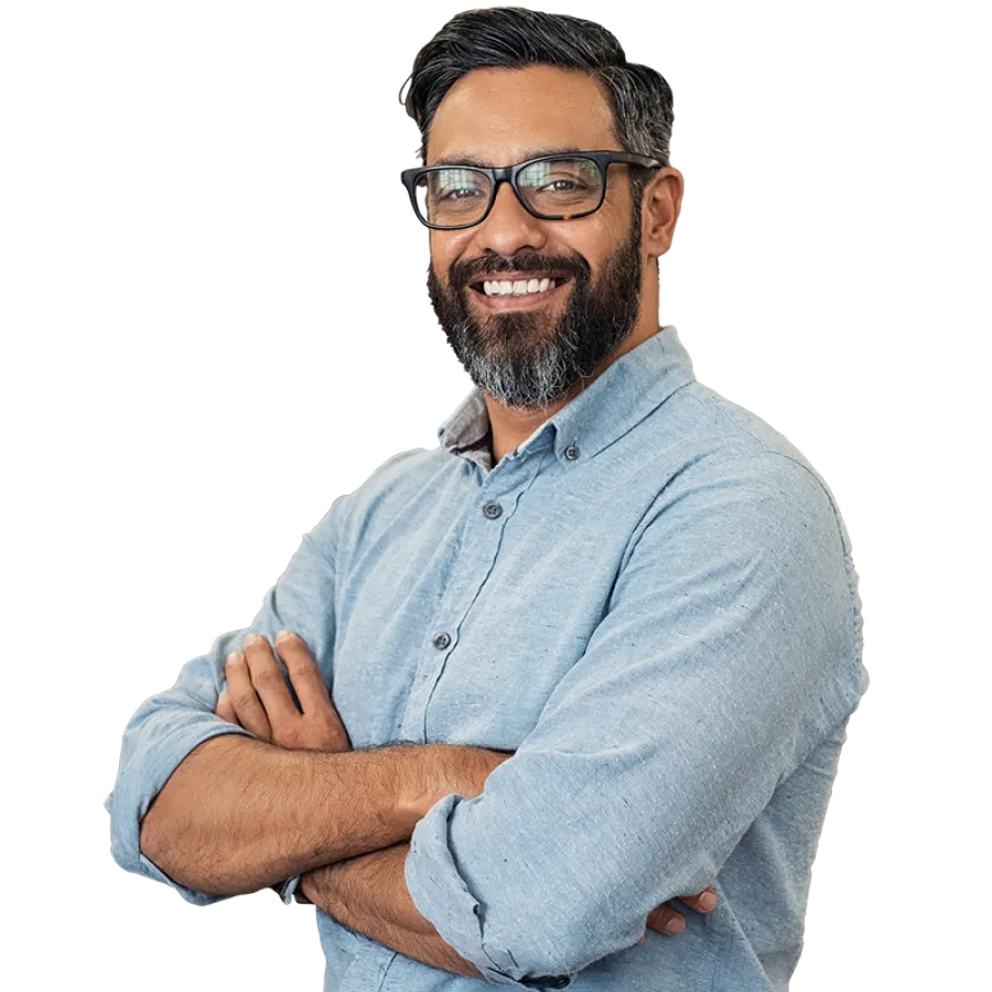 person smiling with arms crossed
