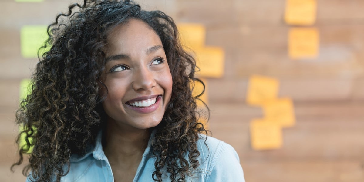 woman in office smiling