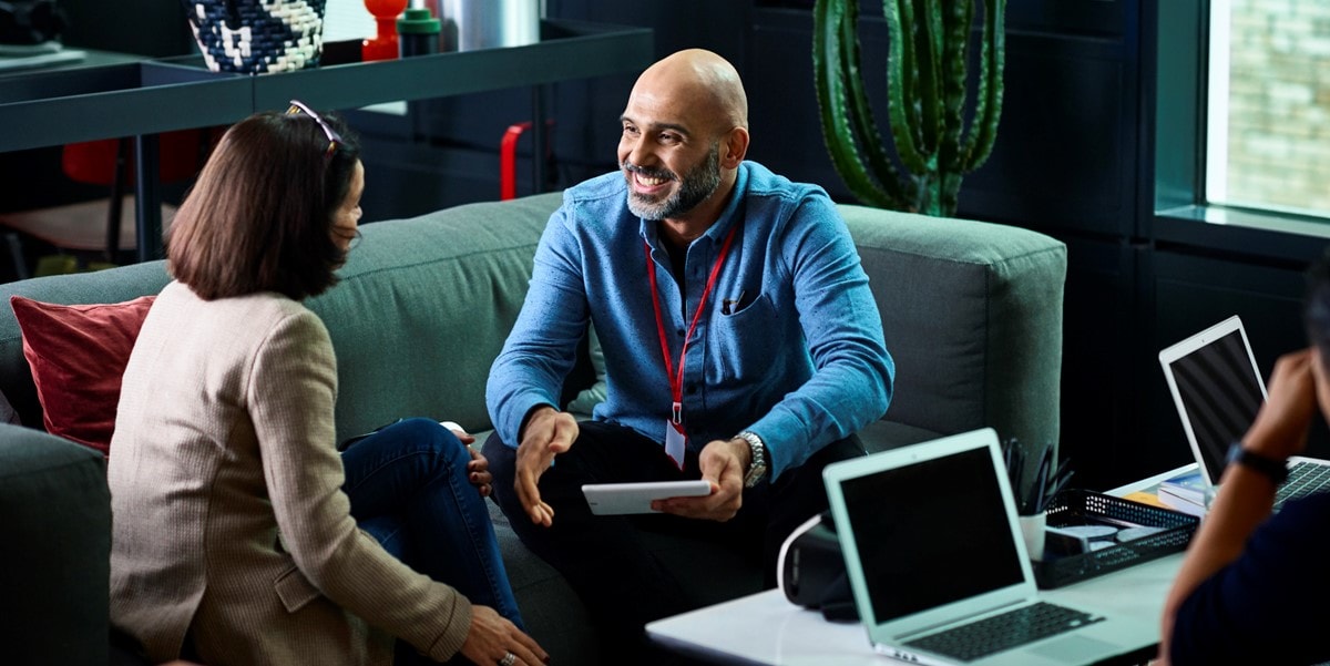 two people meeting in office sitting on couch