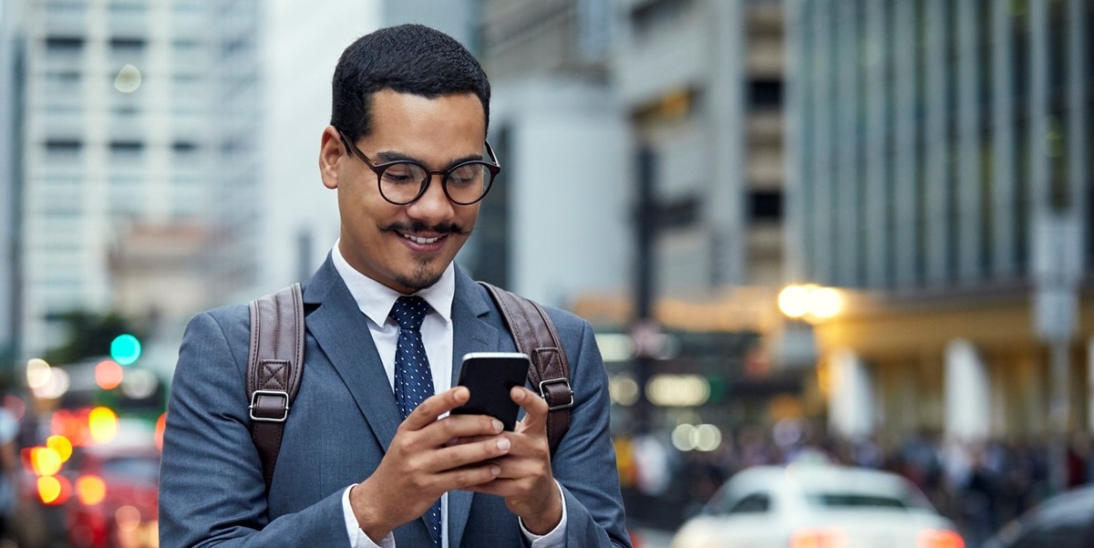 man using phone, outside