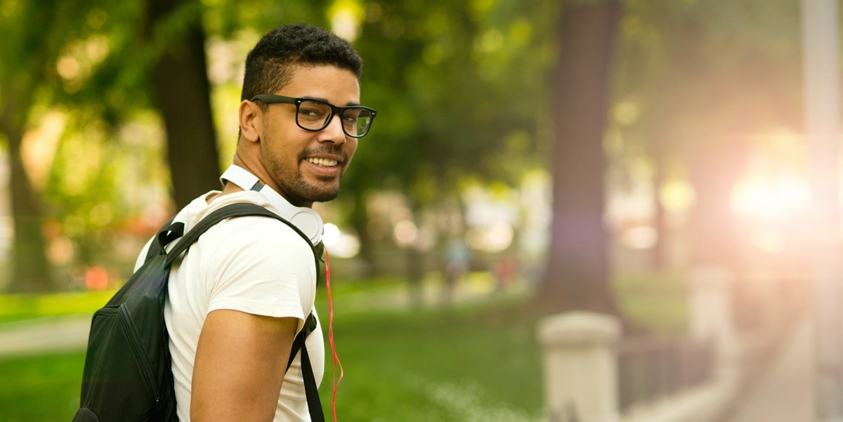 man outside with backpack