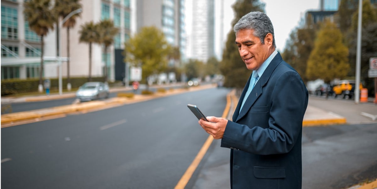 Man standing outside on his phone