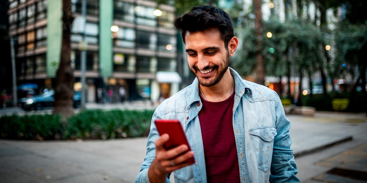 man outside using his phone