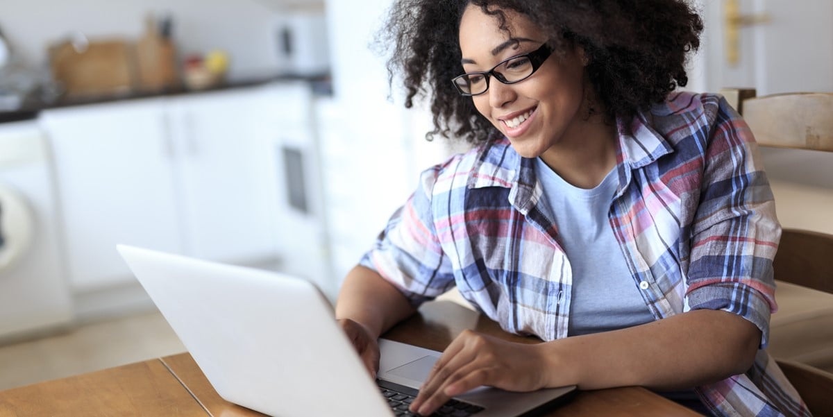 Woman working at a desk on her laptop